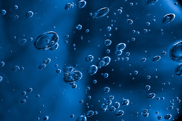 air bubbles in water. dark space background