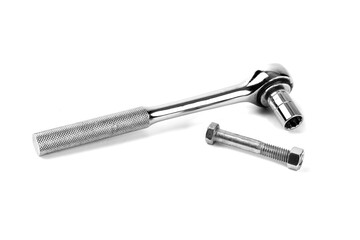 A socket wrench and ratchet handle with a machine bolt and nut isolated on white
