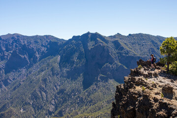 Young woman summit to Bejenado Peak in Caldera de Taburiente, La Palma, Spain
