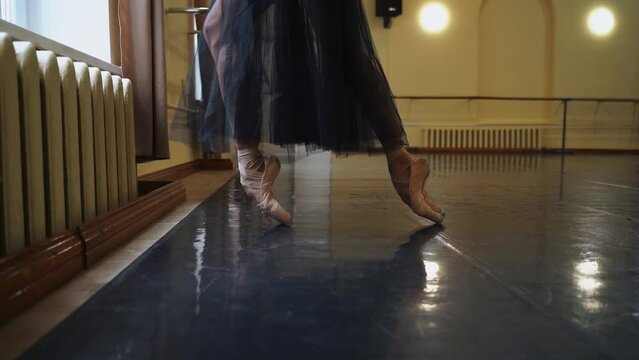 Ballerina's feet during rehearsal in the big hall