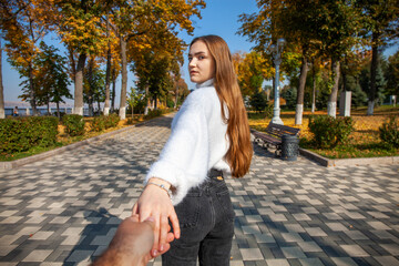 Follow me, young sexy girl holding her boyfriends hands