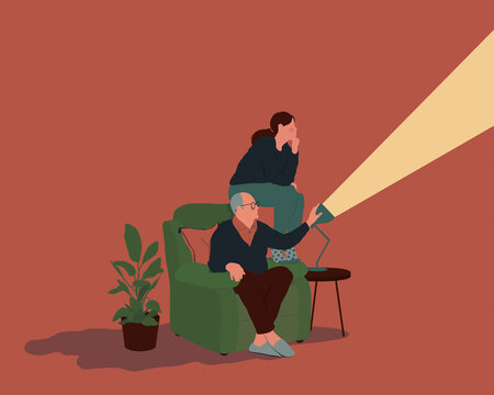 Older man lighting the way forward for young woman