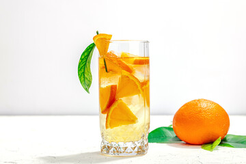 Orange cocktail with ice and ripe fruits. Refreshment seasonal drink, conceptual background © FuzullHanum