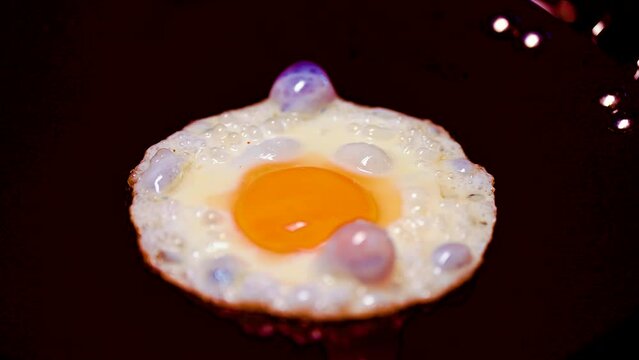 egg yolk frying at hot pen