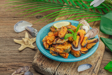 Mussels with oil, spices and greens. Healthy seafood is rich in omega. Marine decor