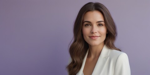 Obraz premium A woman with long brown hair is seen wearing a white blazer while posing in front of a purple background