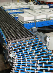 Flexible Conveyor Rollers at Box Packing Line in Factory