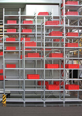 Red Boxes and Crates at Tall Shelf in Distribution Warehouse Storage