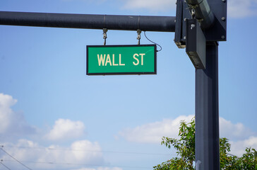 Wall Street sign on the street of the city