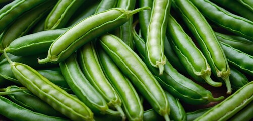   Green beans stacked on two wooden tables