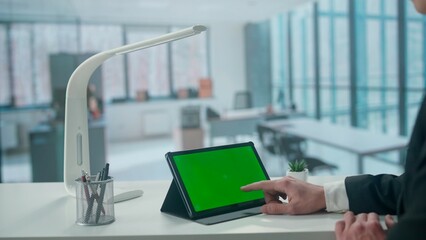 Tablet with Green Screen on Office Desk. Advertising area, workspace mock up.
