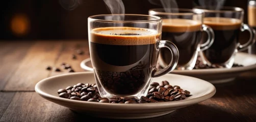 Foto op Plexiglas  A wooden table holds coffee beans and steaming cups of coffee © Viktor