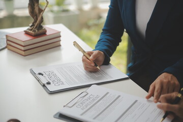 Lawyer, legal advisor, businessman brainstorming information on agreement details Business...