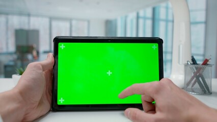 Tablet with Green Screen on Office Desk. Advertising area, workspace mock up.