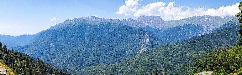 view of the Caucasus Mountains in summer on sunny clear day - panorama