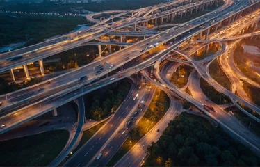 Selbstklebende Fototapete Nanpu-Brücke Aerial view of a complex overpass and busy traffic at dusk., low angle , luxury design. trendy. high quality photo