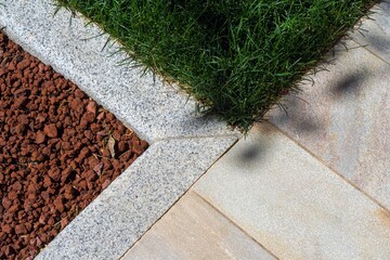 courtyard paving with sandstone plates and gray granite curbs
