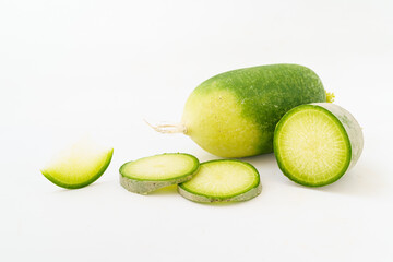 Green radish and radish slices on white background