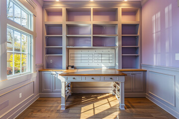 Modern home office in a suburban house with lavender walls, a large desk, and built-in shelves with blank labels for copy space