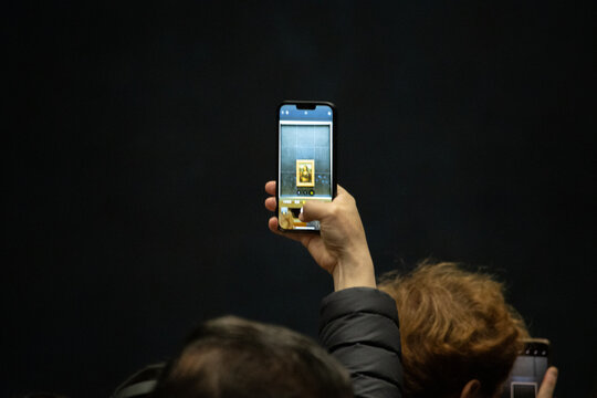 Paris, France, 9 November 2024 : Smartphone Capture of Mona Lisa at the Louvre Museum.