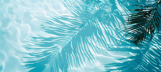Fototapeta na wymiar Gentle ripples of water overlaid with the serene shadow of palm leaves, invoking a sense of calm and tropical serenity