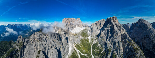 Dolomites, Italy - Panoramic aerial view of the impressive dolomite mountains during summer