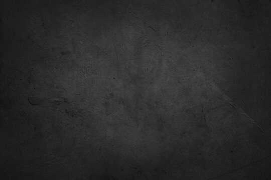 Textured grunge dark grey concrete wall background