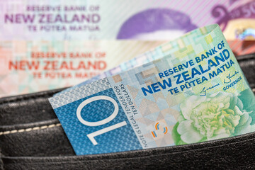 New Zealand money, 10 dollar banknote sticking out of the wallet