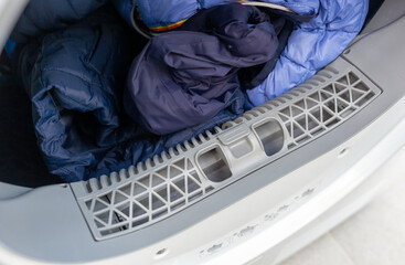 Open dryer with lint trap and clean laundry