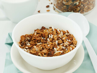 Home made granola in white bowl