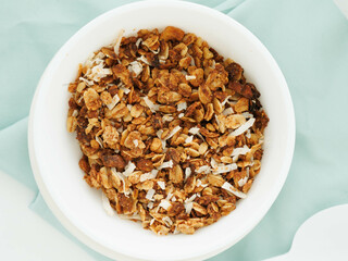 Home made granola in white bowl