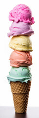 Variety of ice cream scoops one on top of each other in one waffle cone