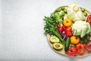Foto op Plexiglas Rustic wooden tray with selection of fresh vegetables and greenery on white kitchen table top view. Vegetarian or diet food from organic ingredients, healthy nutrition concept, space for text © somegirl
