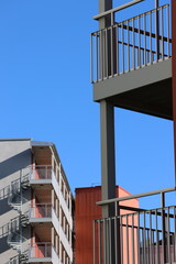 Close-up of high-rise fasade against a striking clear blue sky