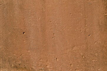 texture, old wall with clay plaster, full of holes, cracks and mold
