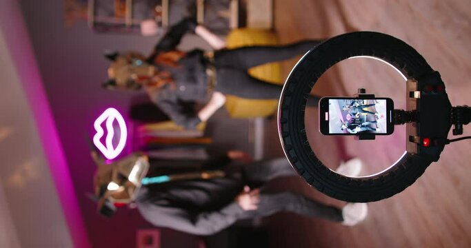 Dance as body language is capable of conveying lot bloggers are actively promoting videos and reels with wide variety of dances one of them in exotic masks with bizarre movements. Vertical video.