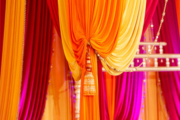 Close up of draped material on Indian wedding event stage