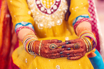 Bridal henna tattoo on hands at Nikah ceremony