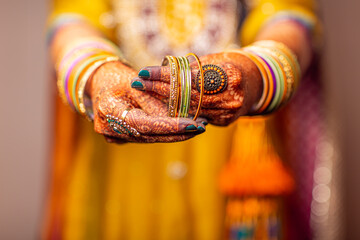 Indian bride with henna prepares for ceremony