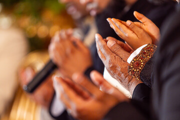 Hands of Muslim men praying