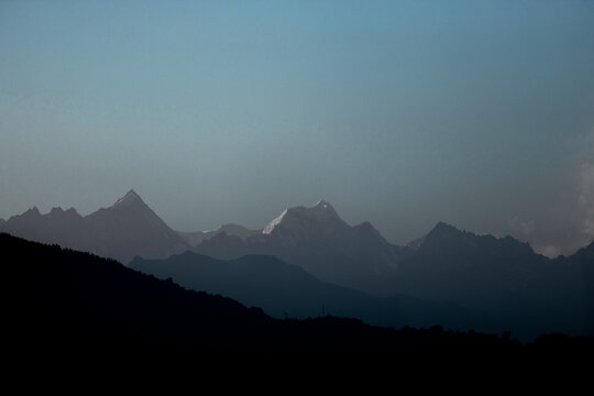 sunrise in the kanchenjunga mountains in india which is the worlds one of the most highest mountain .