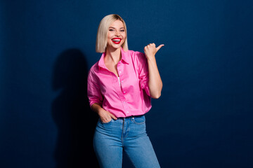 Portrait of cheerful girl with bob hairdo wear stylish shirt indicating at proposition empty space...