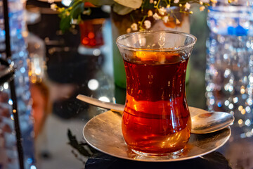 Turkish sweet tea served in traditional glass in restaurant in Istanbul, Turkey