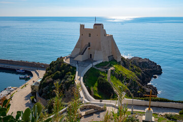 View on white harbour tower from hilly medieval small touristic coastal town Sperlonga and sea...