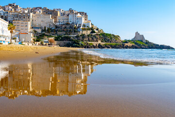 View on sandy beach and sea water in medieval small touristic coastal town Sperlonga and sea shore,...