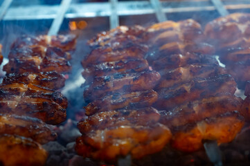 Turkish mixed grill meat, chicken wings, lamb, beef shashlik, kebab cooking on charcoal grill in restaurant