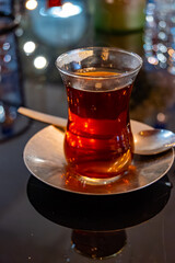 Turkish sweet tea served in traditional glass in restaurant in Istanbul, Turkey