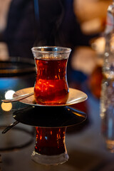 Turkish sweet tea served in traditional glass in restaurant in Istanbul, Turkey