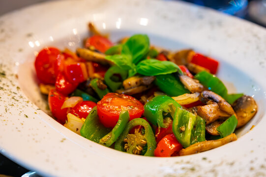 Vegetarian dishes, mezze in Turkish restaurant, grilles mushrooms, pepper and fresh vegetables salad