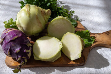 Heads of fresh ripe bio white and purple cabbage kohlrabi from organic farm, close up